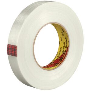 A roll of 3M™ 880 Strapping Tape, part of a 6-pack collection, features clear tape with a yellow core and red plaid interior. This 3/4 x 60 yds. marvel is coiled elegantly to reveal its outer edge and inner core.