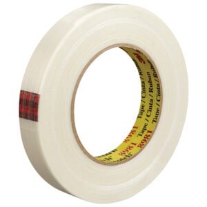 A partially unwound roll of 3/4 x 60 yds. transparent adhesive tape with a cardboard core from the 12 Pack of 3M™ 8981 Strapping Tape, features red plaid packaging design.