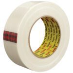 This 1 1/2 x 60 yds. roll from the (12 Pack) 3M™ 8981 Strapping Tape set features a yellow core with black and red text, adorned with a stylish red plaid strip, offering both strength and style for packaging.