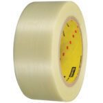 The 2 x 60 yds. Scotch® Filament Tape 898 stands vertically against a white backdrop, featuring a translucent beige tint and a yellow core with red and black lettering, ensuring durability and reliability for packaging needs.