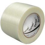 The 3 x 60 yds. Tartan™ Filament Tape 8934 features a ribbed texture and distinct white and red core label design, ideal for packing. Displayed horizontally on a plain white background, it is available in cases of 12 rolls.
