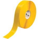 The partially unrolled 2 x 100 Yellow Mighty Line™ Deluxe Safety Tape roll features a visible brand label on its inner core.