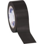 A roll of 2 x 36 yds. black tape from the Tape Logic® Solid Vinyl Safety Tape (3 Pack) slightly unravels, its smooth, shiny surface contrasting starkly against a plain white backdrop. The inner core displays blue and red text and logos, hinting at its quality.