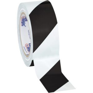 A partially unrolled roll of 2 x 36 yds. Tape Logic® Black/White Striped Vinyl Safety Tape reveals diagonal stripes, with the brand logo on the inner cardboard ring. Sold in a case of 24.