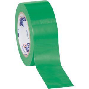 The 2 x 36 yds. Green Tape Logic® Solid Vinyl Safety Tape unrolls sticky side down, boasting a glossy green finish with blue and red branding on the cardboard ring, adding professional flair.