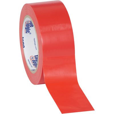 T9236R.jpg A partially unrolled roll of 2 x 36 yds. Red Tape Logic® Solid Vinyl Safety Tape reveals its sticky side, with a white spool and blue text, set against a plain white background—perfect for precision safety applications.