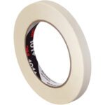 A 1/2 x 60 yds. roll from the 3M Value Masking Tape 101+ series stands upright, showcasing its black inner label with red 3M, against a plain white background that enhances its professional look.