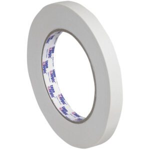 A pack of Tape Logic® 2600 Masking Tape, 1/2 x 60 yds. (12 Pack), with a cardboard core, stands upright displaying its circular form and branded inner side against a plain background.
