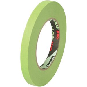 Upright on its edge, the 1/2 x 60 yds. (12 Pack) 3M High Performance Green Masking Tape 401+ roll flaunts its thin width and circular shape with a dark inner core, showcasing the iconic 3M and Scotch logos against a white backdrop.