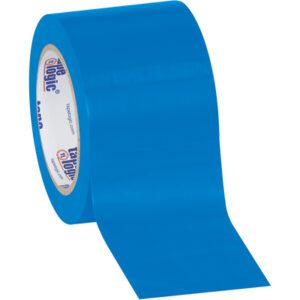 An unrolled 3 x 36 yds. roll of Tape Logic® Solid Vinyl Safety Tape, blue with a glossy finish, displays its inner spool marked with bold blue and orange branding against a white backdrop.