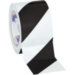 A roll of 3 x 36 yds. Black/White Tape Logic® Striped Vinyl Safety Tape shows its striking diagonal stripes when unrolled. Its available in packs of 16 per case for easy deployment.