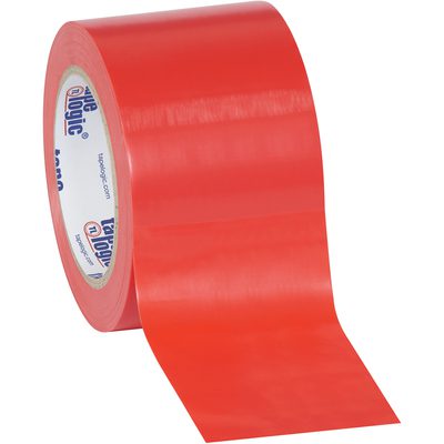 T9336R.jpg A roll of 3 x 36 yds. Red Tape Logic® Solid Vinyl Safety Tape (16/Case) is unrolled, showing its glossy red surface and an inner reel featuring white with blue and red printing.