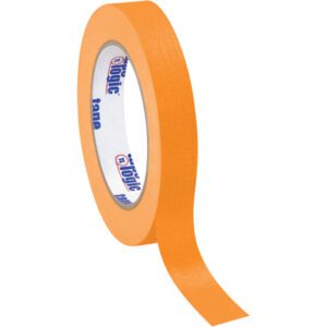 A partially unrolled roll from the 3/4 x 60 yds. Orange Tape Logic® Masking Tape (12 Pack) reveals blue text on a white background, ideal for precision projects.