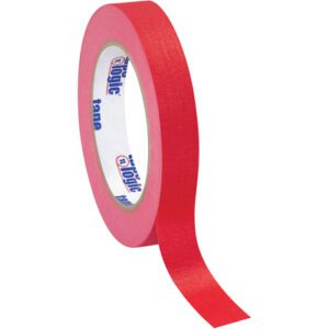 A 3/4 x 60 yds. roll of Red Tape Logic® Masking Tape from a 12 pack stands vertically, slightly unrolled, exposing its inner label against a plain white background.