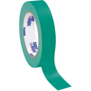 A partially unrolled roll of 1 x 60 yds. dark green Tape Logic® masking tape reveals its label; this matte finish tape is perfect for crafting or sealing and sold in a convenient 12 pack for multiple uses.