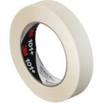 A roll of 1 x 60 yds. 3M Value Masking Tape 101+ with a black inner label and red 3M logo. Partially unwound, its matte texture ensures quality. Available in cases of 36 rolls for convenience.