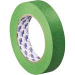 A 12-pack of 1 x 60 yds. Tape Logic® 3200 Green Painters Tape stands upright, revealing branding on its core, with a smooth surface promising reliable precision in painting tasks.