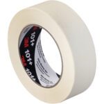 A 1 1/2 x 60 yds. roll of 3M Value Masking Tape 101+ features a beige exterior and black/red inner label, shown angled to display the side and part of the inner cardboard ring. Sold in sets of 24 rolls per case.
