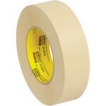 A 12-pack of beige 3M™ 231 Masking Tape, each measuring 1 1/2 x 60 yds., has a yellow inner core with the brand name and details. Displayed elevated and angled to highlight its width and thickness, it offers versatile use.