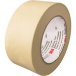 A roll of 2 x 60 yds. 3M™ 203 Masking Tape, featuring its logo on the inner core, sits on a white background. The tape is part of a convenient set of 24 rolls per case.