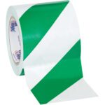 The MH-USA 4 x 36 yds. Tape Logic Striped Vinyl Safety Tape features diagonal green and white stripes, partially unrolled to showcase its pattern. Sold in a convenient pack of three per case to meet safety needs.
