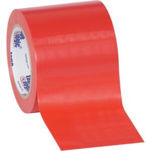 A partially unrolled 4 x 36 yds. Red Tape Logic® Solid Vinyl Safety Tape from a 3 Pack reveals its smooth surface. The white inner core with blue and white text sits angled against a plain white backdrop, ready for your next project.
