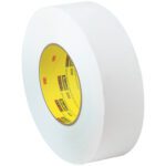 A roll of 1 x 60 yds. 3M™ 2526 Flatback Tape with a yellow label displaying red and black text is set against a white background.