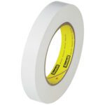 A roll from the 12-pack of 3M™ 256 White Flatback Tape, sized at 1 x 60 yds and featuring a yellow Scotch inner core, stands upright against a plain background.