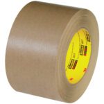 A 3 x 60 yds. brown adhesive tape displays a yellow core with the Scotch logo and tilted to highlight the width and thickness of the 3M™ 2517 Flatback Tape (12/Case).