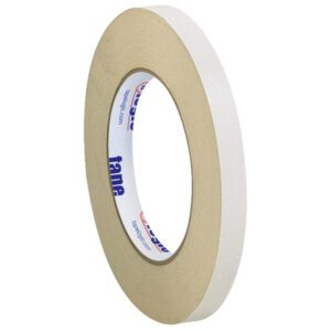 A roll of 1/2 x 36 yds. (3 Pack) Tape Logic® Double Sided Masking Tape is displayed upright on a white background, featuring blue and red text on the inner cardboard ring, highlighting the detailed design of this versatile masking tape.