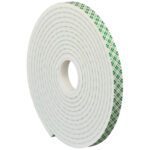 The 1/2 x 5 yds. 3M Double Sided Foam Tape 4004, in the classic green and white plaid pattern, stands upright with its inner core displayed, offering reliable adhesion and convenience in a single roll per case.