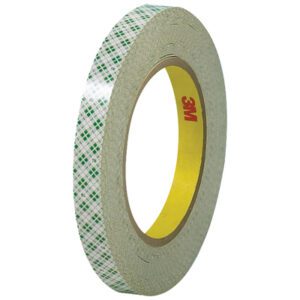 A 1/2 x 36 yds. roll of double-sided adhesive tape, featuring a plaid pattern and yellow core, is set against a white backdrop. Expertly crafted by 3M - 410M, this masking tape comes in a versatile (3 Pack).