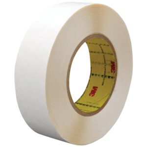 A roll of wide, white tape with a visible core, featuring 3M™ in red text, from the 1 x 36 yds. (2 Pack) 3M™ 9579 Double Sided Film Tape. Positioned at an angle, it shows both the outer surface and inner core.