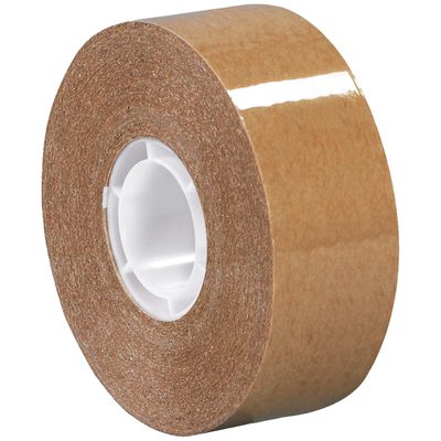 T9544672PK.jpg A roll of Tape Logic Heavy-Duty Adhesive Transfer Tape with a white core, shiny surface, and strong brown adhesive side lies on its side. The MH-USA 3/4 x 18 yds. - 2 per case reflects light slightly.