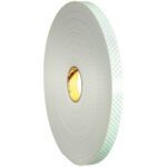 A large roll of 1 x 36 yds. 3M™ 4008 Double Sided Foam Tape with a gray outer, green patterned inner surface, showcases its thickness and diameter, conveniently packaged in cases of nine.