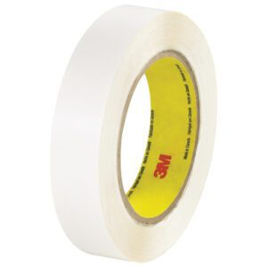 A partially unrolled roll of 1 x 36 yds. white adhesive tape reveals its texture and thickness. Featuring the yellow inner core with the 3M logo, this reliable 3M™ 444 Double Sided Film Tape comes in a convenient (6 Pack), perfect for your projects.