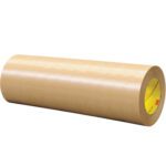 A large roll of brown kraft paper with a yellow core, positioned against a white background, mimics the cylindrical shape and smooth texture of the 12 x 60 yds. (1 Pack) 3M™ 465 Adhesive Transfer Tape Hand Rolls - 1 PER CASE.