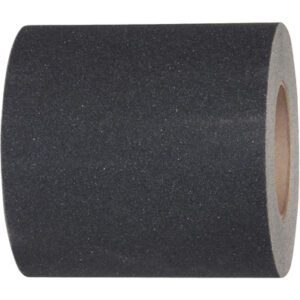 The image highlights a tightly coiled roll of 12 x 60 Black Tape Logic® Anti-Slip Tape (1 Roll/Case), emphasizing its rough texture and cylindrical shape, with the inner cardboard core visible as part of this practical, durable safety product.