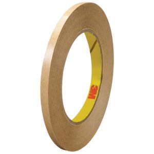 A 6-pack of 1/4 x 60 yds. 3M™ 465 Adhesive Transfer Tape Hand Rolls with a thin, brown tape and yellow core displaying the red 3M logo is shown upright, emphasizing its circular shape and narrow width.