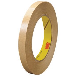 The 3M™ 465 Adhesive Transfer Tape Hand Rolls, featuring a brown tape with a yellow core and the red 3M logo, are durable and reliable. This 6 pack of 1/2 x 60 yds. rolls is ideal for precise applications, showcasing its thickness and circular shape.