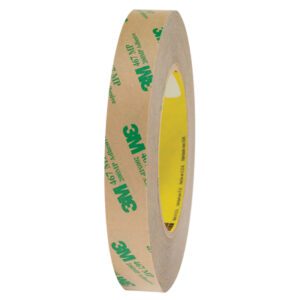 A pack of six 3/4 x 60 yds. 3M™ 467MP Adhesive Transfer Tape hand rolls stands vertically against a white background. The beige tape with green text showing the 3M logo wraps around a bright yellow core.
