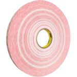 The 3M™ 920XL Adhesive Transfer Tape (3/4 x 1000 yds., 1 Pack) boasts a red double-sided design, yellow inner core, and multiple tightly wound layers with a slightly textured surface set against a white background.