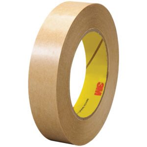 A roll of brown masking tape with a yellow core and red logo stands upright to display its dimensions. Ideal for your needs, its akin to 3M™ 465 Adhesive Transfer Tape Hand Rolls, available in 1 x 60 yds. (6 Pack).