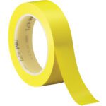 The 1 x 36 yds. (6 Pack) Yellow 3M Vinyl Tape 471, with a vibrant color and partially unrolled edge, displays Made in USA on its core, ensuring quality and reliability for projects.