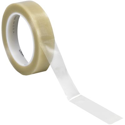 T965471C.jpg On a plain white background, a roll of 1 x 36 yds. Clear 3M Vinyl Tape 471 (36 Rolls/Case) is showcased with its transparent texture and subtle beige tint as a section unrolls.