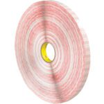 The 1 x 540 yds. 3M™ 476XL Double Sided Tape (6 Rolls/Case) is a large, red and white adhesive tape with a yellow core, featuring a tightly wound circular shape that offers a distinctively layered appearance.