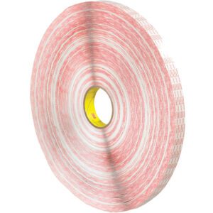 The 1 x 540 yds. (2 Pack) 3M™ 476XL Double Sided Extended Liner Tape has a red and white design, visible central hole, even layers showing red adhesive sides, and a core with a yellow label.