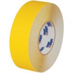 A 1 x 60 roll of yellow heavy-duty Tape Logic® anti-slip tape, ideal for demanding tasks, with the brand printed on the core.