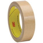 A roll of 3M™ 927 Adhesive Transfer Tape Hand Rolls, measuring 1 x 60 yds., showcases the 3M logo inside its yellow core while standing on edge against a white background.