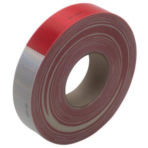 The 2 x 150 Red/White 3M™ 983 Reflective Tape (1/Case), with diamond-shaped patterns, wraps elegantly around its cardboard core, featuring alternating red and white sections that enhance visibility for safety purposes.